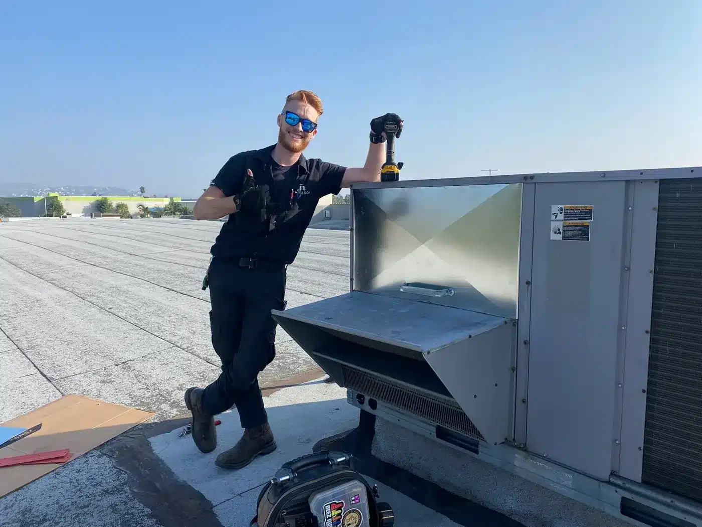 Thomson at work on commercial rooftop equipment